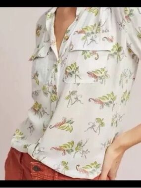 Maeve Anthropologie jungle animal and floral printed button-up blouse.